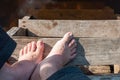 Men`s feet without shoes on steps above the water Royalty Free Stock Photo