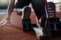 Men`s feet on starting block ready Royalty Free Stock Photo