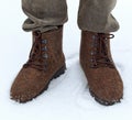 Men`s feets in the shoes of wool Valenki Royalty Free Stock Photo