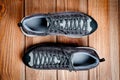 Men`s gray-brown sports shoes laced with laces. Close-up shot Royalty Free Stock Photo