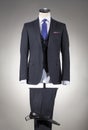 Men`s gray suit and white shirt and blue tie Royalty Free Stock Photo