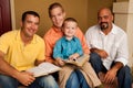 Men`s Group Bible Study. Father reading the bible with his son.