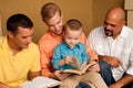 Men`s Group Bible Study. Father reading the bible with his son.