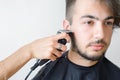 Men's hairstyling and haircutting in a barber shop or hair salon Royalty Free Stock Photo