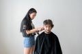 Men's hairstyling and haircutting in a barber shop or hair salon Royalty Free Stock Photo