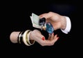 Men's hand giving to woman's hand eurobanknotes and car keys Royalty Free Stock Photo