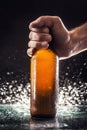 Men`s hand holding a bottle of beer Royalty Free Stock Photo
