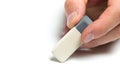 Men`s hand holding eraser on isolated backgroung, close up Royalty Free Stock Photo