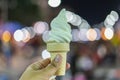 Men`s hand holding ice cream cone Royalty Free Stock Photo