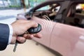 Men& x27;s hand presses on the remote control car alarm systems. Royalty Free Stock Photo