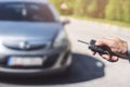 Men`s hand presses on the remote control car alarm systems Royalty Free Stock Photo