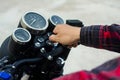 Men`s hand start the motorcycle keys. Royalty Free Stock Photo