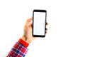 Men`s hands in a checkered hipster shirt are holding a smartphone on a white background. The screen is white and black. Hands Royalty Free Stock Photo