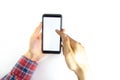 Men`s hands in a checkered hipster shirt are holding a smartphone on a white background. The screen is white and black. Hands Royalty Free Stock Photo