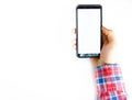 Men`s hands in a checkered hipster shirt are holding a smartphone on a white background. The screen is white and black. Hands Royalty Free Stock Photo