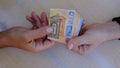 men's hands exchange money, euro banknotes