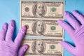 Men`s hands in gloves holding unfolded dollars Royalty Free Stock Photo