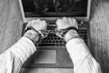 Men`s hands handcuffed on a laptop.