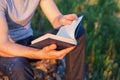 Men's hands hold the open book Royalty Free Stock Photo