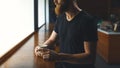 Men`s hands holding a mug of coffee