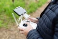 Men`s hands holding remote control of drone. Using technology Royalty Free Stock Photo