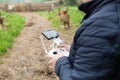 Men`s hands holding remote control of drone. Using technology Royalty Free Stock Photo