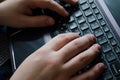 Men`s hands on the keyboard. Keyboard. Work on a laptop. Typing text. Job. Text. Letters Brushes on the keyboard. Work Royalty Free Stock Photo