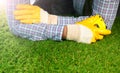 Men`s hands with measure tape on artificial grass Royalty Free Stock Photo