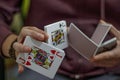 Men`s hands with playing cards