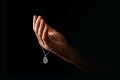 Men`s hands in prayer on a black background. The concept of faith, prayer, mourning, forgiveness, confession Royalty Free Stock Photo