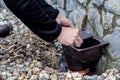 Men`s hands put a cleaner on the gutter Royalty Free Stock Photo