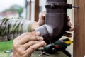 Men`s hands seal the gutter on the outside Royalty Free Stock Photo