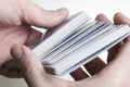 Men's hands shuffle a deck of cards Royalty Free Stock Photo