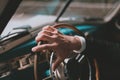 Men's hands on the steering wheel. inside a retro car. Retro style Royalty Free Stock Photo