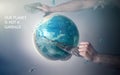 Men`s hands tear off a plastic bag from the globe of planet Earth. The concept of environmental protection. Eco. Tint and slogan Royalty Free Stock Photo