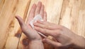 Men`s hands use antiseptic, wipe with a napkin close-up,