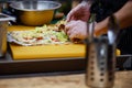 Men`s hands wrapping traditional shawarma wrap with chicken and vegetables Royalty Free Stock Photo