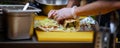 Men`s hands wrapping traditional shawarma wrap with chicken and vegetables Royalty Free Stock Photo