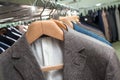 Men`s jackets on hangers suits in the store Royalty Free Stock Photo