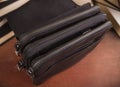 Men`s leather bag with zippers closed; Three department bags