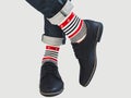 Men`s legs, bright socks with and shoes