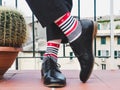 Men`s legs, stylish shoes and colorful socks Royalty Free Stock Photo