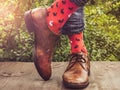 Men`s legs in stylish shoes and funny socks Royalty Free Stock Photo