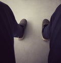 Men`s legs wearing black shoes uniform pants, concept, stress, job loss, warning, fired, anxiety