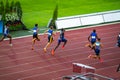 Men's 100m Sprint Race Commencement at a Track and Field Event: Athletes in Action on the Running Track Royalty Free Stock Photo