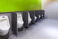 Men`s room urinals discharge of waste from the body Royalty Free Stock Photo