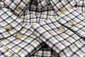 Men\'s shirt. Plaid shirt sleeve with buttons. Piece of clothing. Button