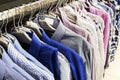 Men`s shirts of different colors on hangers. Selective focus. Close up Royalty Free Stock Photo