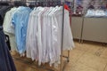 Men`s shirts on a hanger in the store