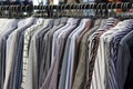 Men`s shirts on hangers in the store, close-up Royalty Free Stock Photo